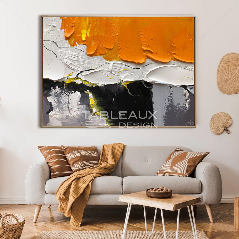 Un tableau abstrait en nuances d'orange et noir