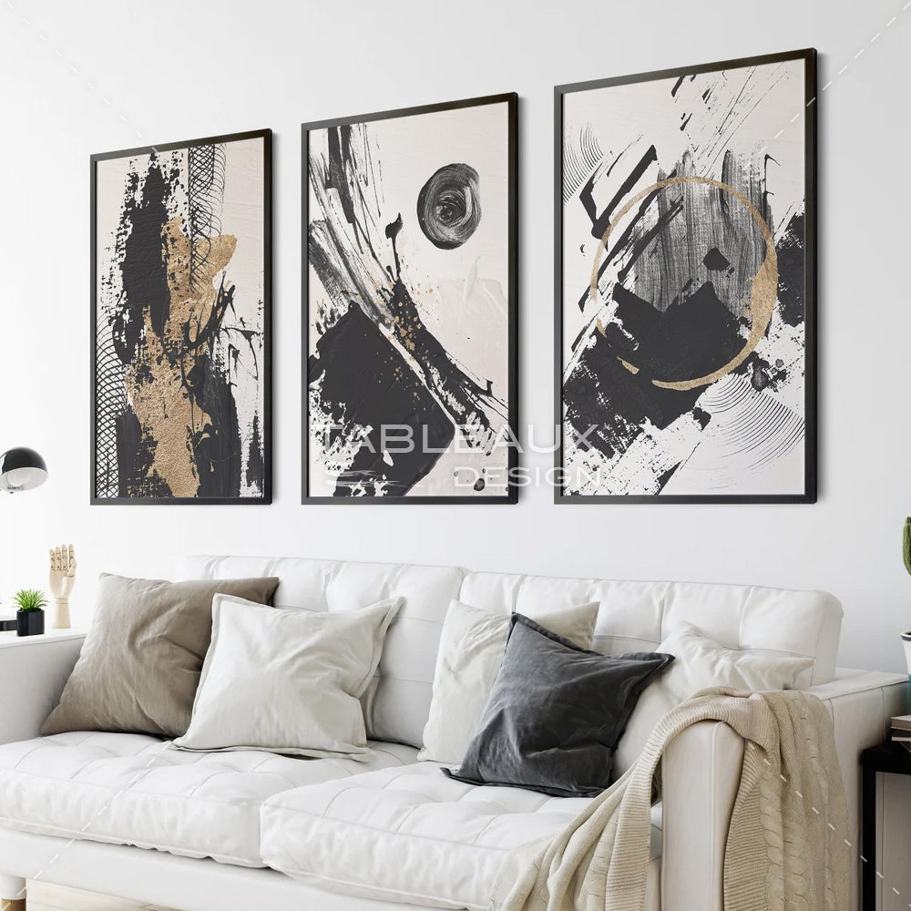 Lumière d'or sur noir profond : un triptyque abstrait aux reflets dorés - tableauxdesign
